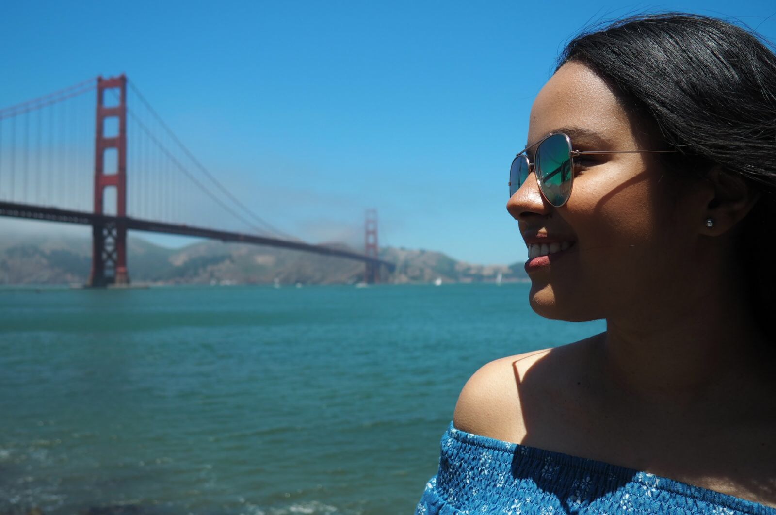 Mariana in San Francisco, with the infamous Golden Gate Bridge in the background.
