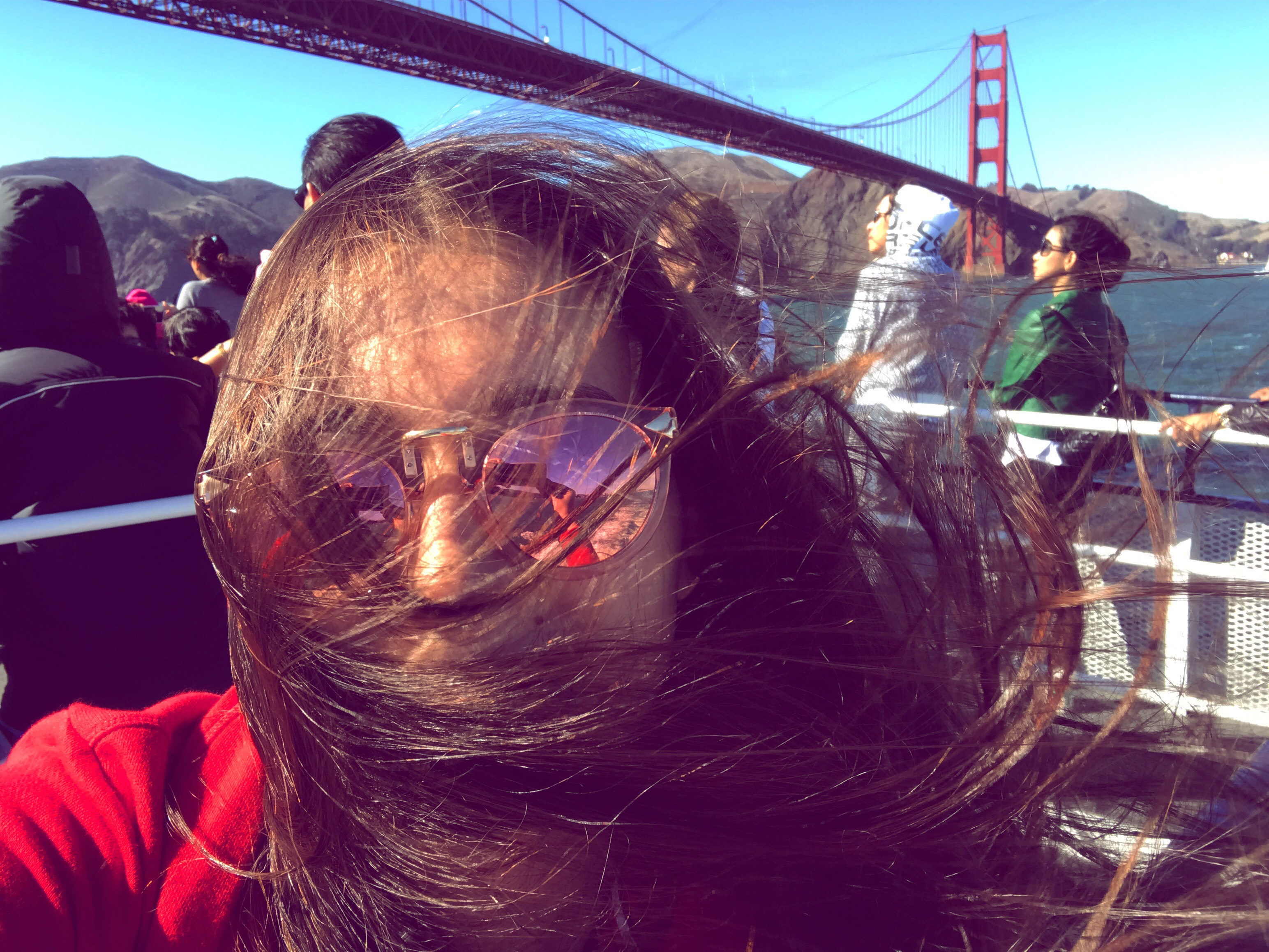 Katerine posing in front of the Golden Gate Bridge.