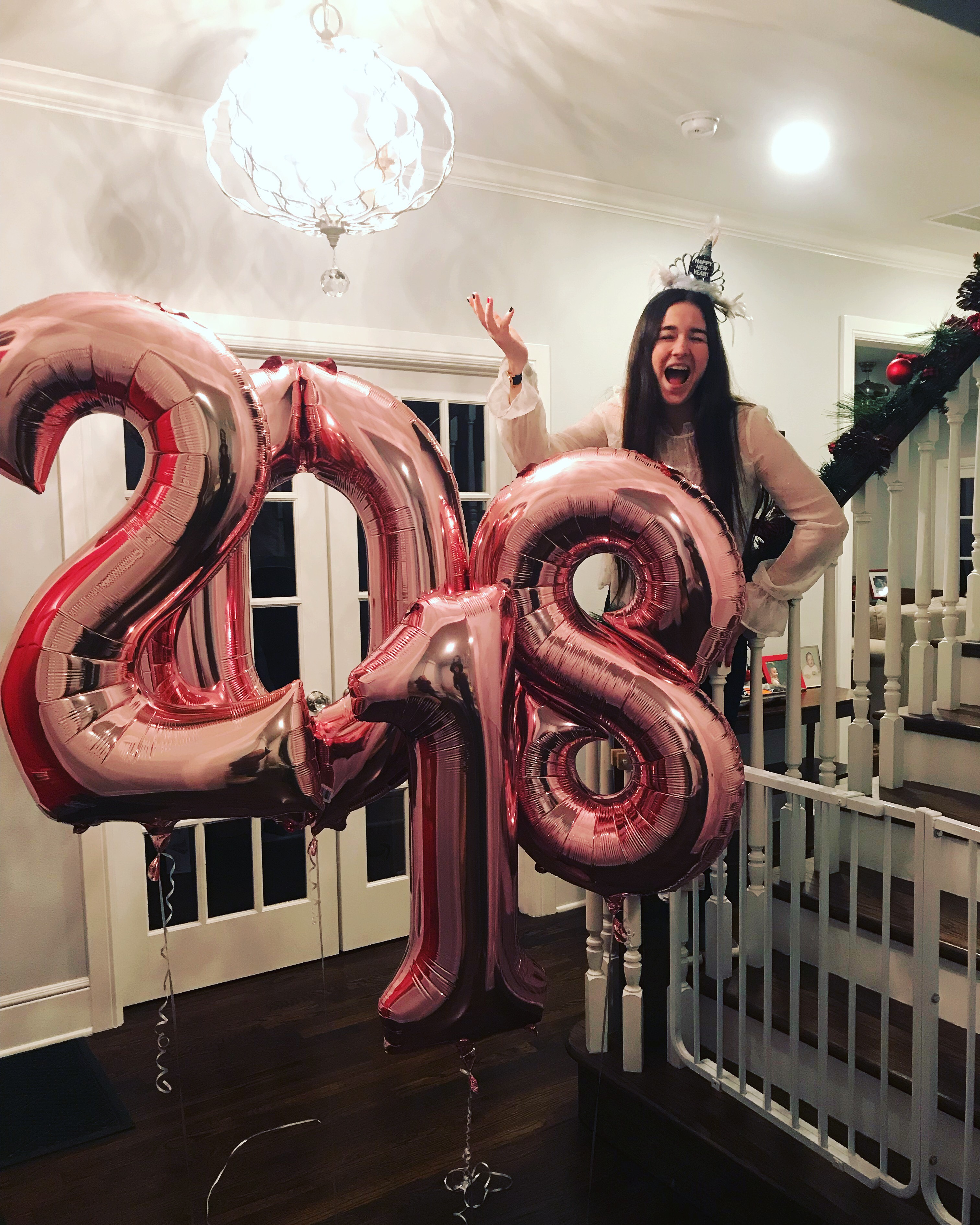 Katerine with some pink "2018" balloons.